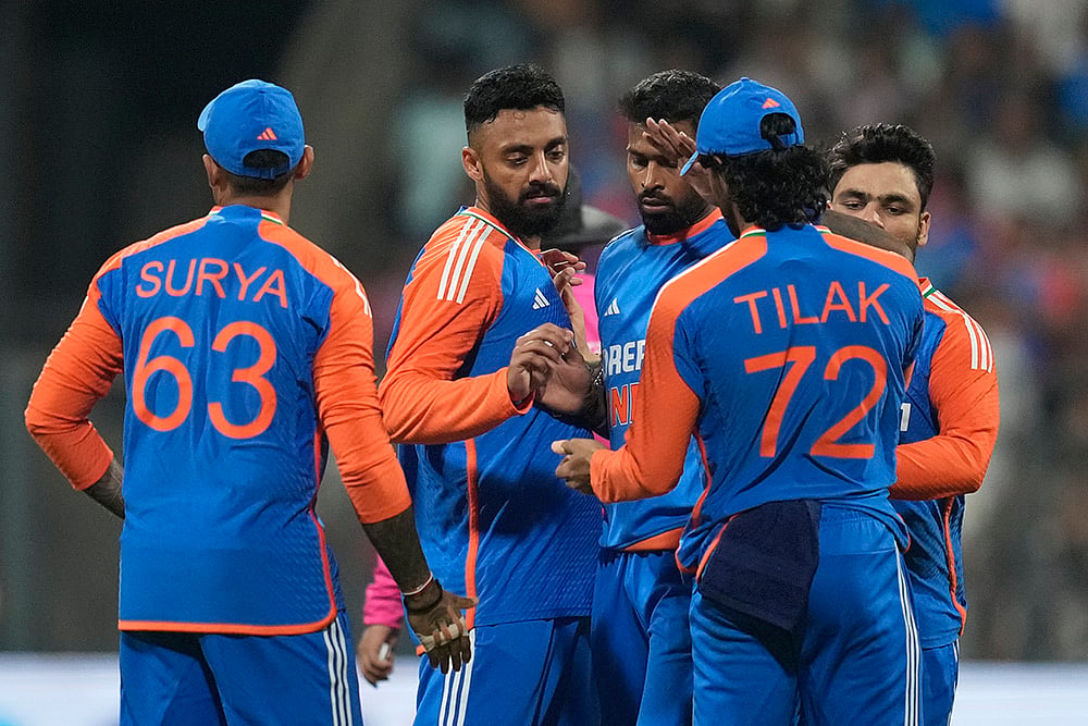 India Vs England Cricket IND vs ENG 5th T20I Photo from Mumbai: Varun Chakravarthy