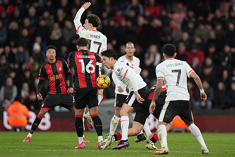 English Premier League 2024-25: Liverpool's Wataru Endo, bottom centre, controls the ball