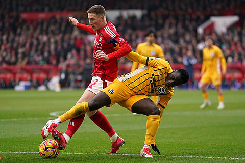 English Premier League: Nottingham Forest's Elliot Anderson and Brighton and Hove Albion's Yankuba Minteh, right, battle for the ball