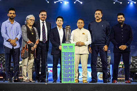 Indian cricket legends pose with the trophy of ICC Men’s Champions Trophy 2025 at the Wankhede Stadium during Trophy Tour with DP World in India