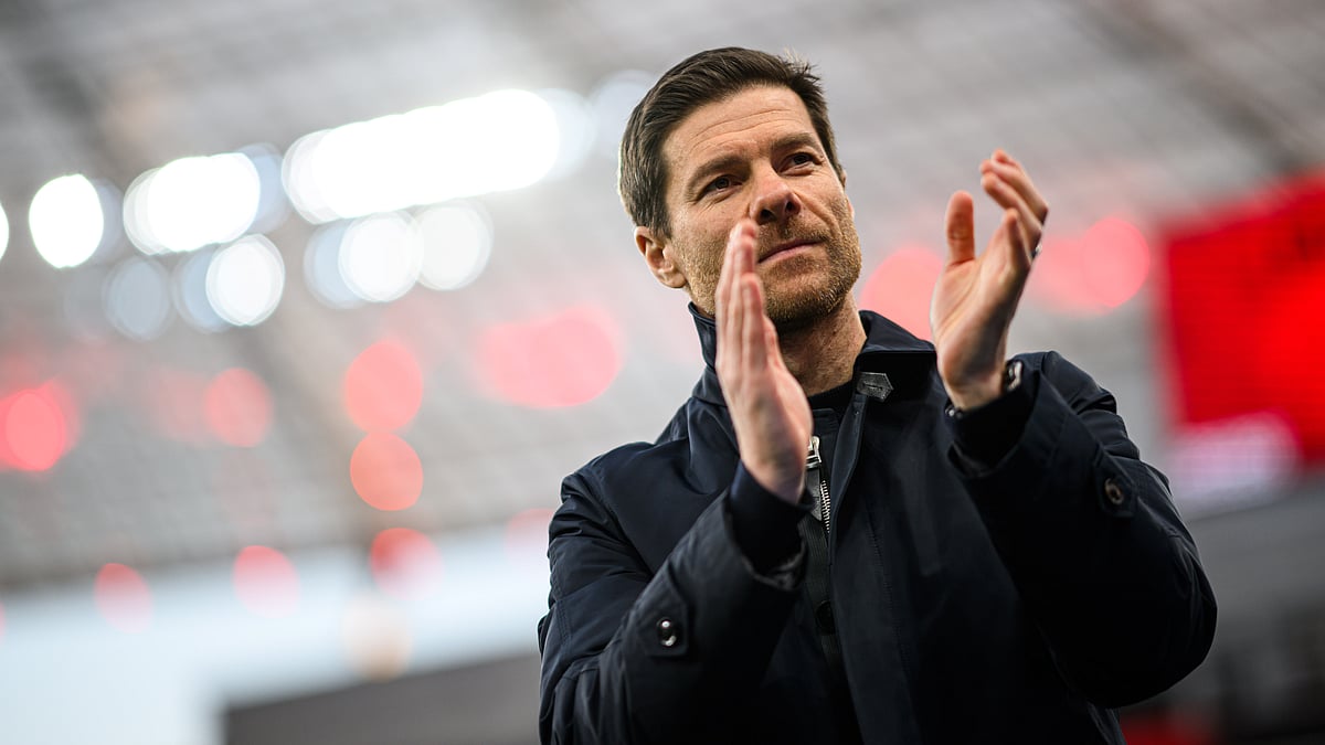 Xabi Alonso applauds Bayer Leverkusen's supporters after Sunday's win