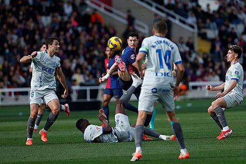 La Liga 2024-25: Barcelona's Robert Lewandowski challenges for the ball 