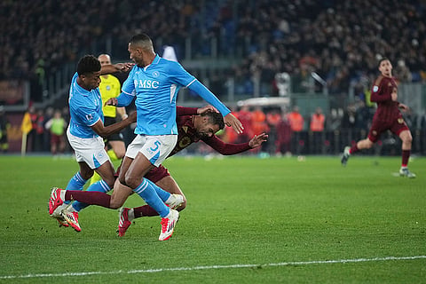 Serie A 2024-25: Napoli's David Neres and Juan Jesus challenge for the ball with Roma's Evan Ndicka