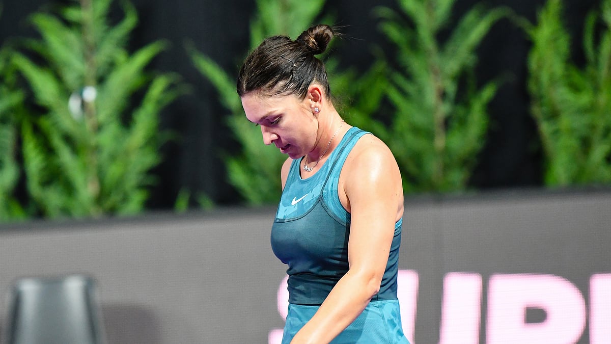 Simona Halep was beaten in straight sets by Lucia Bronzetti