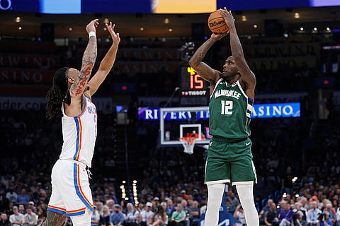 NBA 2024-25: Milwaukee forward Taurean Prince (12) looks to shoot over City forward Jaylin Williams