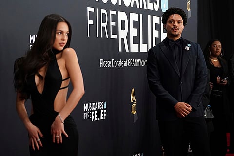Olivia Rodrigo, left, and Trevor Noah