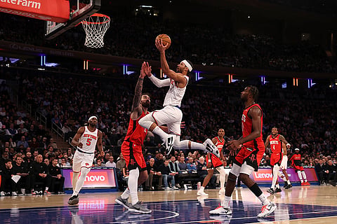NBA 2024-25: Knicks' Josh Hart, center right, shoots the ball 