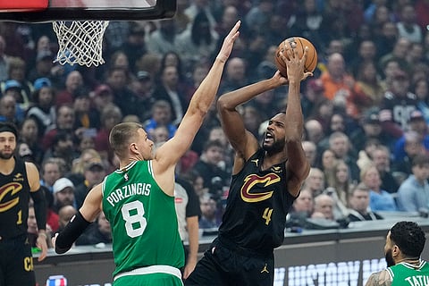 NBA 2024-25: Cavaliers forward Evan Mobley (4) shoots