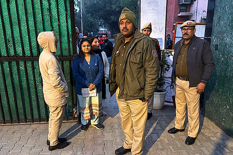 Delhi Elections 2025 Voting: People stand in a queue to cast their votes