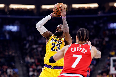 NBA 2024-25: Lakers forward LeBron James shoots basket against Clippers guard Amir Coffey