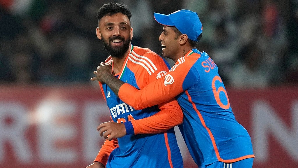 AP : Varun Chakravarthy, left, and India captain Suryakumar Yadav during the T20 series against England.