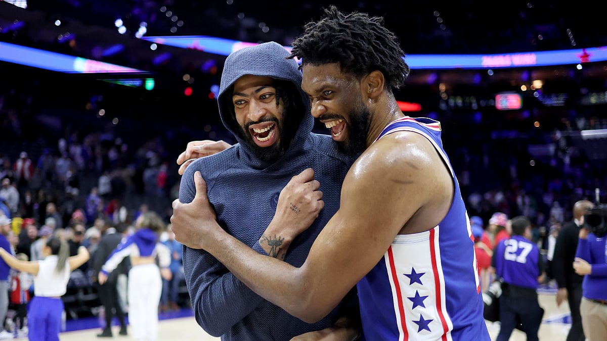 Joel Embiid (right) starred against the Mavericks