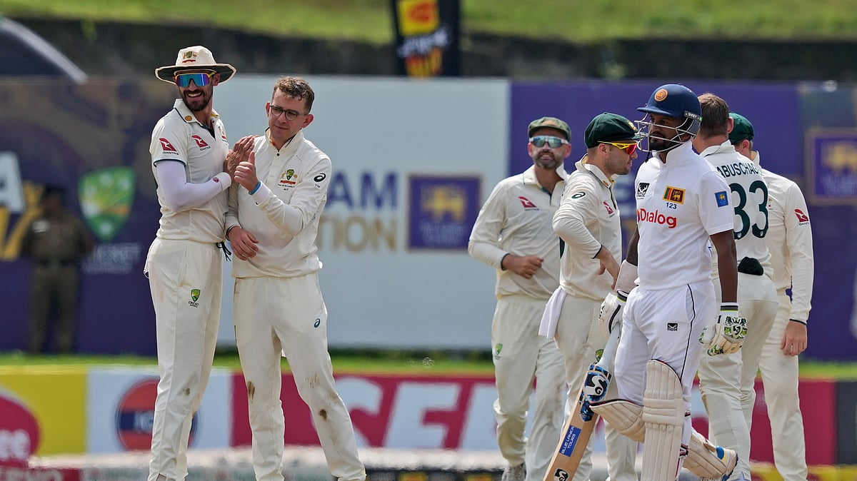 AP Photo/Eranga Jayawardena : Australia's Todd Murphy celebrates the wicket of Sri Lanka's Dimuth Karunaratne during day four of the first test cricket match between Sri Lanka and Australia in Galle.