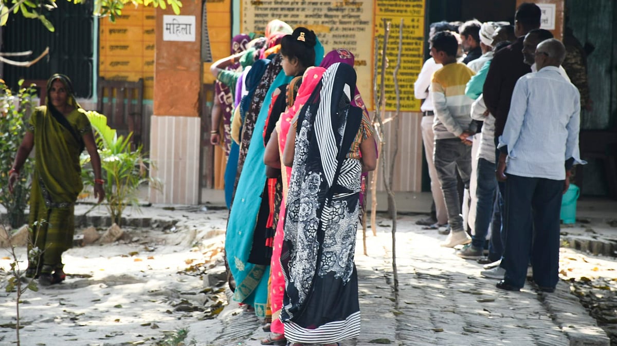 People wait to cast their votes during the Milkipur Assembly by-election, in Ayodhya district, Wednesday, Feb. 5, 2025.  - PTI