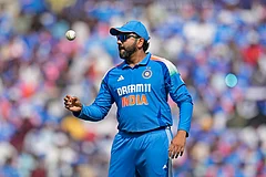 IND Vs ENG 1st ODI: India's Rohit Sharma tosses the ball - | Photo: AP/Aijaz Rahi