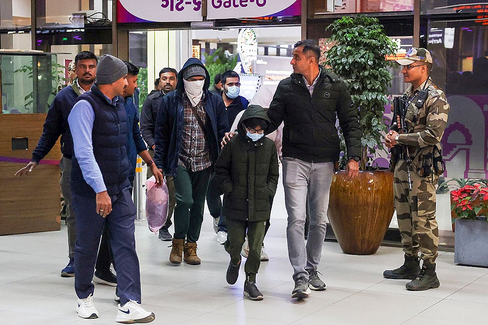 | Photo: PTI : Gujaratis deported from US brought to Ahmedabad