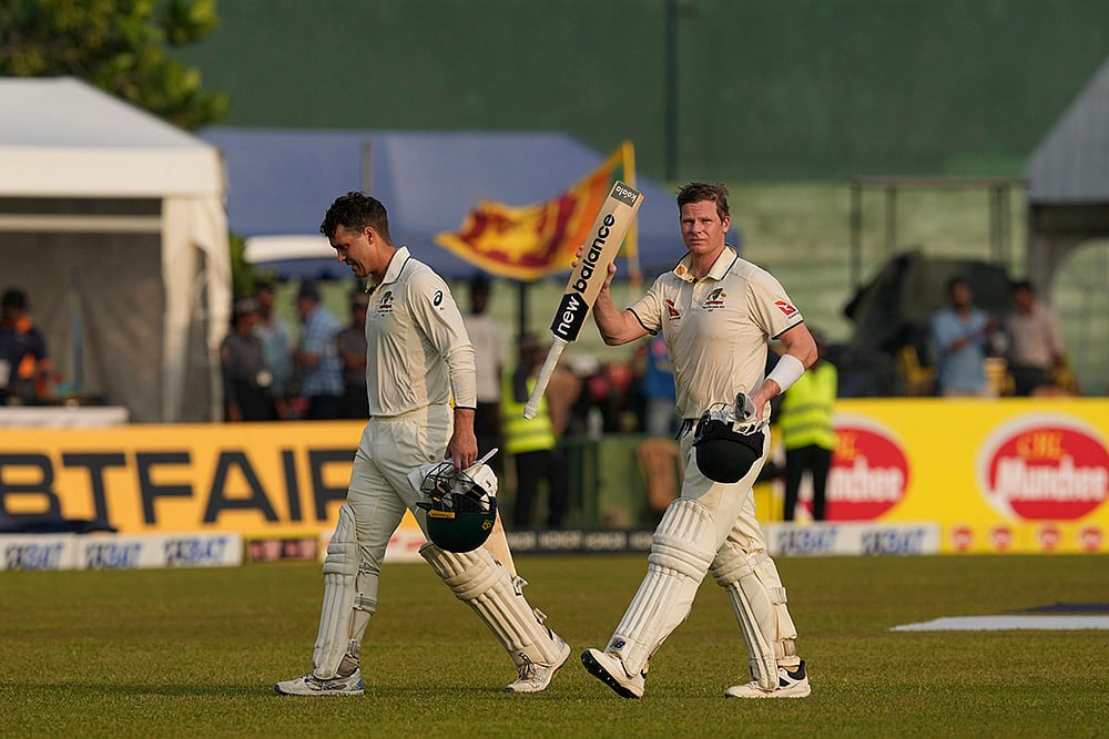 | Photo: AP/Eranga Jayawardena : SL Vs AUS 2nd Test Day 2: Australia's Steven Smith and Alex Carey leave the ground