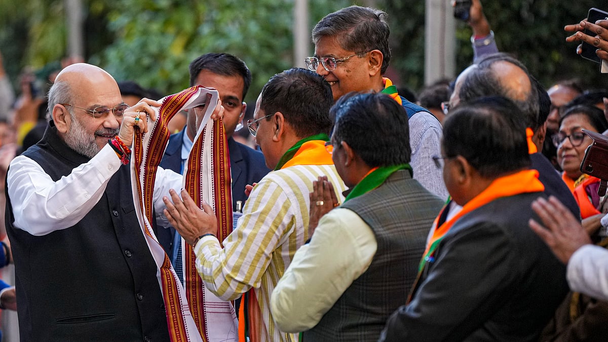 PTI/Arun Sharma : BJP leaders celebrating at party headquarters.