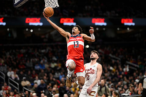 NBA 2024-25: Wizards guard Jordan Poole (13) goes to the basket 
