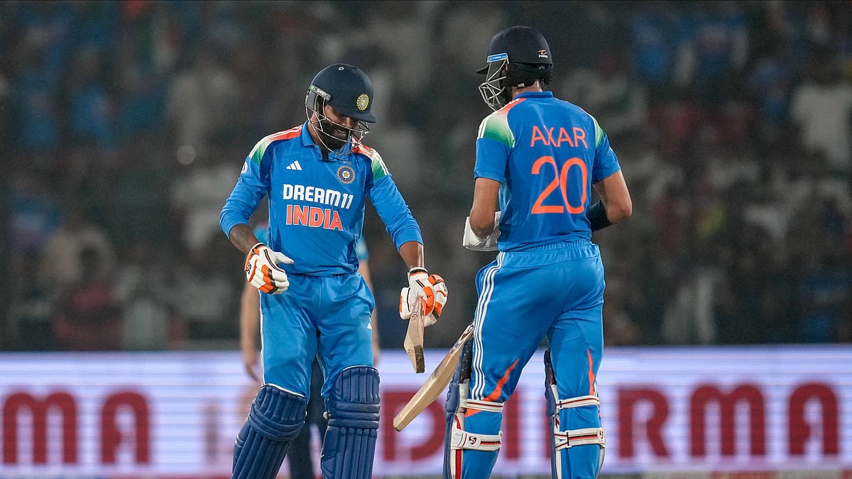 India's Ravindra Jadeja, left, and Axar Patel celebrate after winning the second one day international cricket match against England in Cuttack. - AP Photo/Rafiq Maqbool
