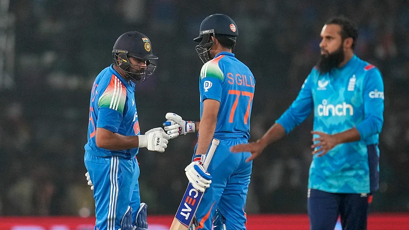 Indian captain Rohit Sharma, left, is greeted. AP Photo