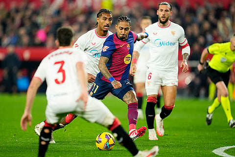 La Liga 2024-25: Raphinha, center, scores his side's third goal