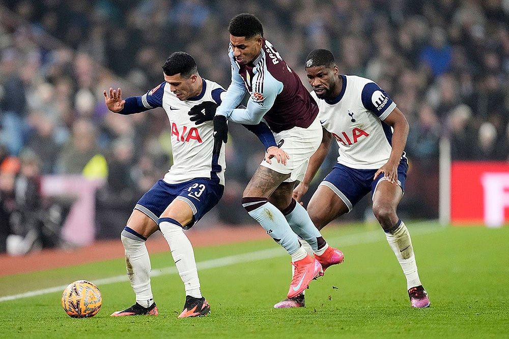 | Photo: Nick Potts/PA via AP : FA Cup Fourth Round: Aston Villa's Marcus Rashford battles for the ball with Tottenham Hotspur's Pedro Porro