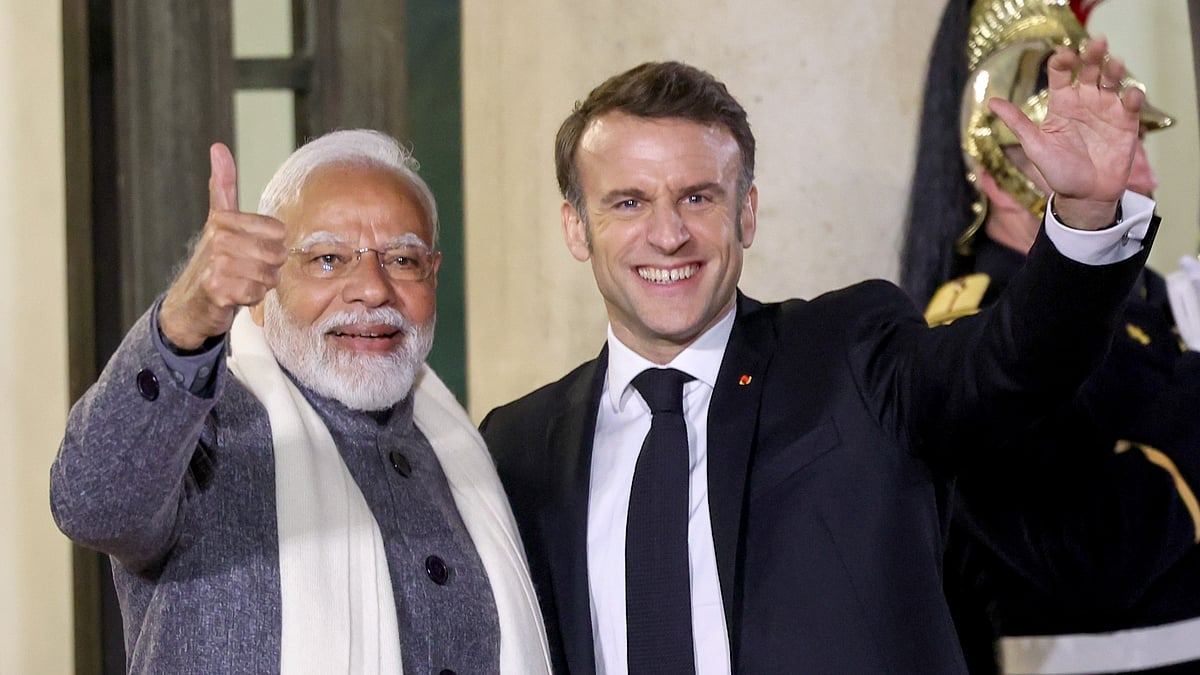 PTI :  In this image released by PMO on Tuesday, Feb. 11, 2025, Prime Minister Narendra Modi is greeted by President of France Emmanuel Macron as he arrives for a reception at Elysee Palace in Paris. 