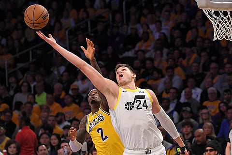 NBA 2024-25: Jazz center Walker Kessler (24) battles Lakers forward Jarred Vanderbilt for a rebound
