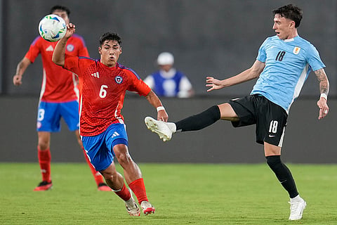 CONMEBOL U20 Championship: Chile's Gabriel Pinto and Uruguay's German Barbas compete for the ball