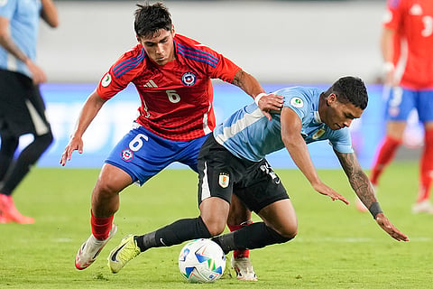 CONMEBOL U20 Championship: Chile's Gabriel Pinto and Uruguay's Jorge Severo fight for the ball