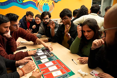 Strangers Playing a Board Game at Whiz Cafe X Thai Fuze, Organised by South Delhi Meetup Community 