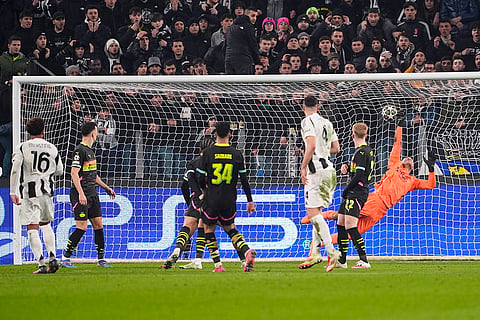 Champions League playoff first leg: Juventus' Weston McKennie, left, scores their side's first goal