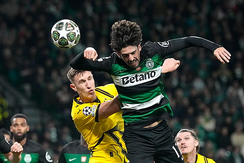 Champions League playoff first leg: Dortmund's Nico Schlotterbeck challenges for the ball with Sporting's Francisco Trincao