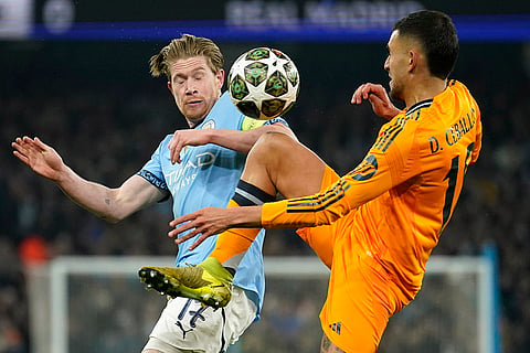 Champions League playoff first leg: Real Madrid's Dani Ceballos challenges Manchester City's Kevin De Bruyne