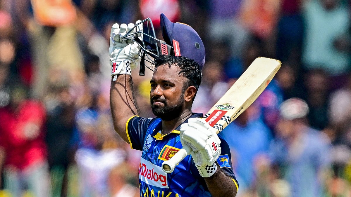 Charith Asalanka celebrates scoring a century against Australia