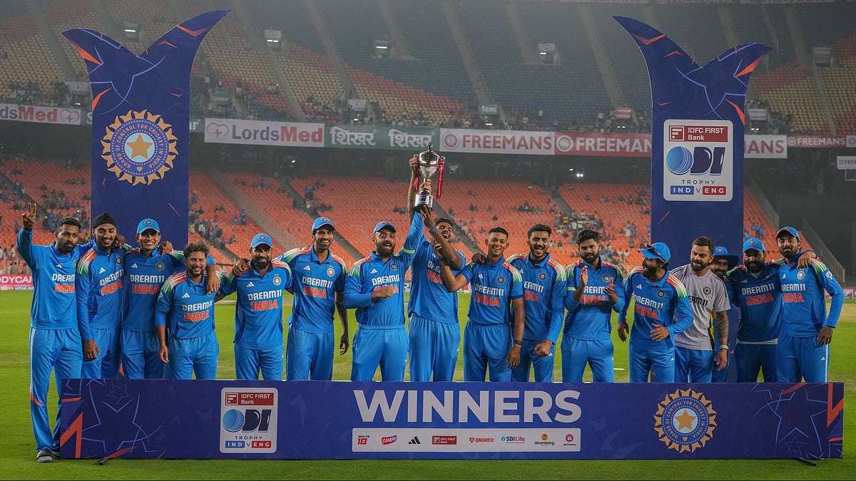 Indian players pose with the trophy. AP Photo