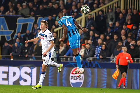 Champions League playoff first leg: Brugge's Joel Ordonez and Atalanta's Charles De Ketelaere jump for the ball