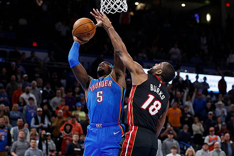 NBA 2024-25: Thunder guard Luguentz Dort (5) tries to score