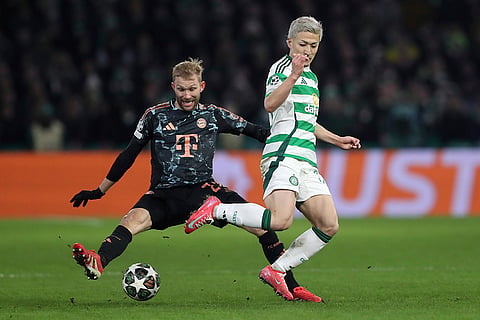 Champions League playoff first leg: Bayern's Konrad Laimer and Celtic's Daizen Maeda challenge for the ball 