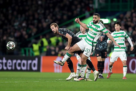 Champions League playoff first leg: Bayern's Harry Kane heads the ball besides Celtic's Cameron Carter-Vickers 