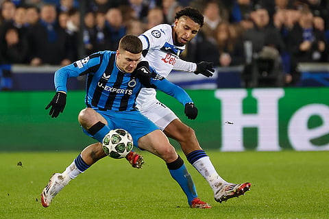 Champions League playoff first leg: Brugge's Christos Tzolis and Atalanta's Ederson fight for the ball