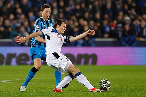 Champions League playoff first leg: Brugge's Hans Vanaken and Atalanta's Marten de Roon fight for the ball