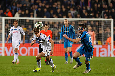 Champions League playoff first leg: Brugge's Brandon Mechele and Atalanta's Charles De Ketelaere vie for the ball