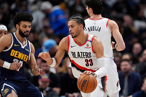 NBA 2024-25: Trail Blazers forward Toumani Camara drives to the basket 