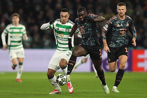 Champions League playoff first leg: Celtic's Adam Idah and Bayern's Dayot Upamecano challenge for the ball 