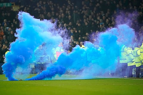 EPL 2024-25: Soccer fans use a flare 