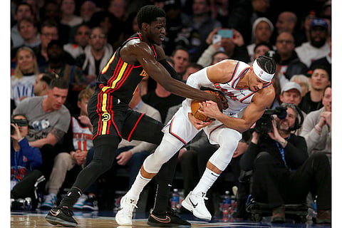 NBA 2024-25: Hawks forward Mouhamed Gueye and Knicks guard Josh Hart battle for the ball 