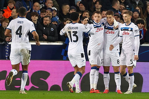 Champions League playoff first leg: Atalanta's Mario Pasalic celebrates with his teammates after scoring against Brugge