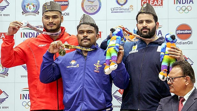 Medallists in the men's 102kg weightlifting competition of National Games 2025. - PTI
